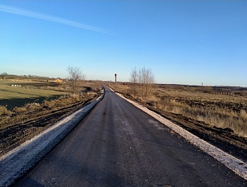 Завершена укладка второго слоя асфальта на дороге до д. Федосовка Кимовского района
